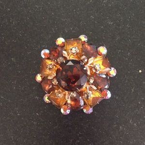 Vintage brooch with glass “gems” set in metalwork